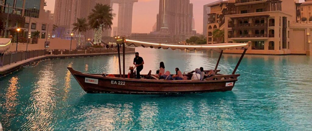 Traditional abras boats in Dubai floating on the marina water